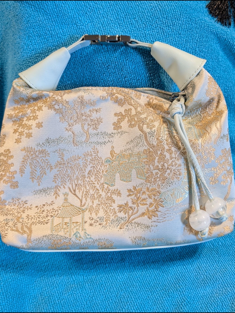Elegant Light Blue Jacquard Shoulder Bag with Gold Motif